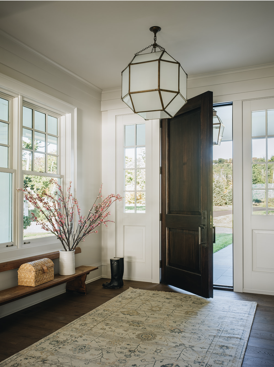 Jean Stoffer Design entry foyer with Visual Comfort chandelier and wood bench - Stoffer Photography Interiors