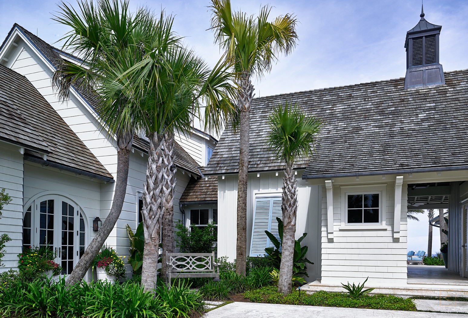This Ponte Vedra white coastal home with light blue shutters by the talented Collins Interiors is elegant, fresh and fun--everything a beach house should be! Nathan Schroder Photography