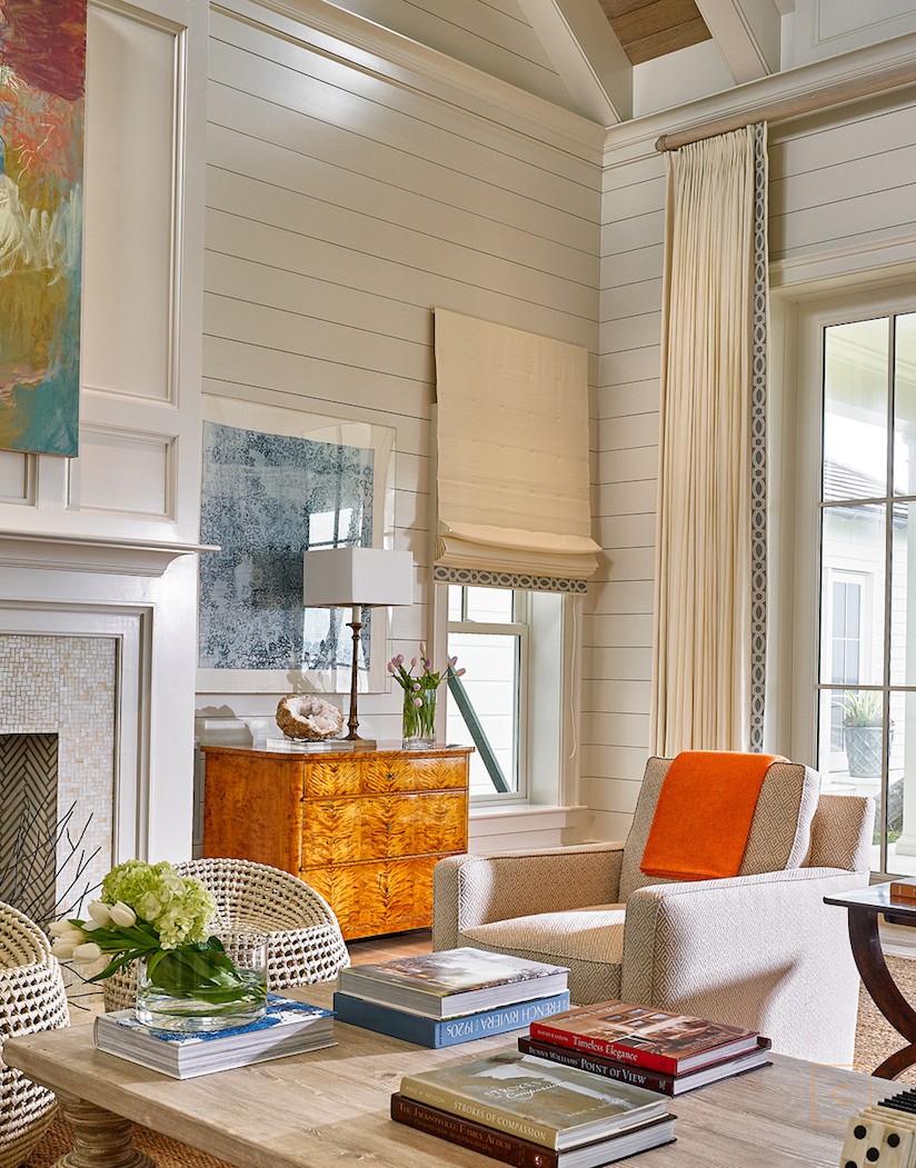 This stunning Ponte Vedra home design by the talented Collins Interiors is elegant, fresh and fun--everything a beach house should be! Nathan Schroder Photography - shiplap in the living room with modern art