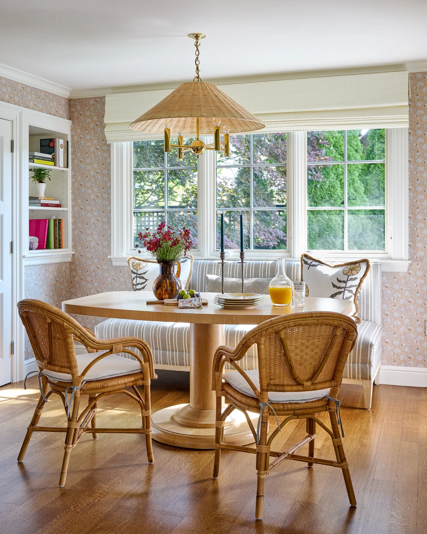 Honey Collins Interior Design | Pauli & Uribe Architects |  Liz Daly Photography-    We love a stylish breakfast room and these banquette seating ideas blend comfort and style for an inviting kitchen! Love this cozy breakfast nook with the charming wallpaper and wicker chandelier