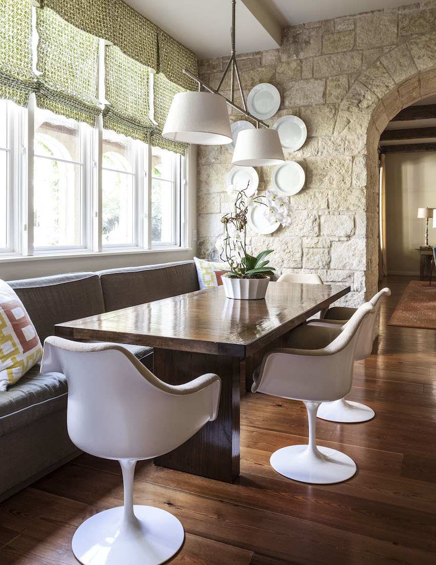 Collins Interiors | Nathan Schroder Photography - charming breakfast nook with banquette and stone walls