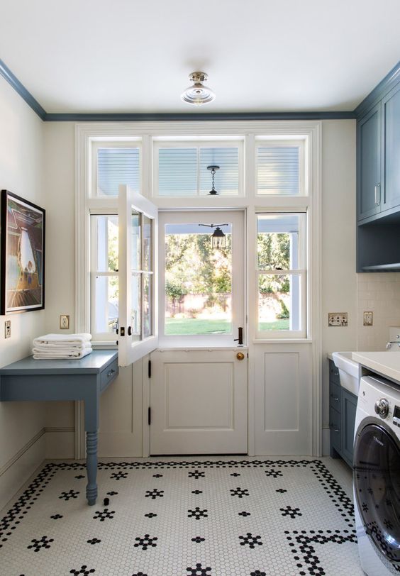 laundry room with black and white tile