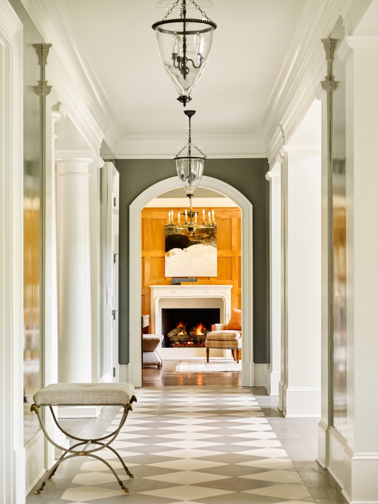 Harrison Design foyer with bell chandeliers