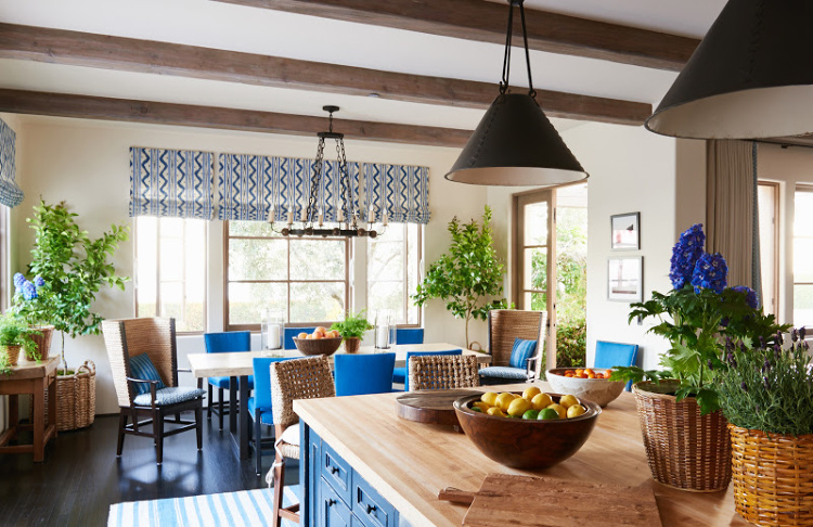 Montecito house tour by Mark Sikes kitchen with black pendants over island in blue and white