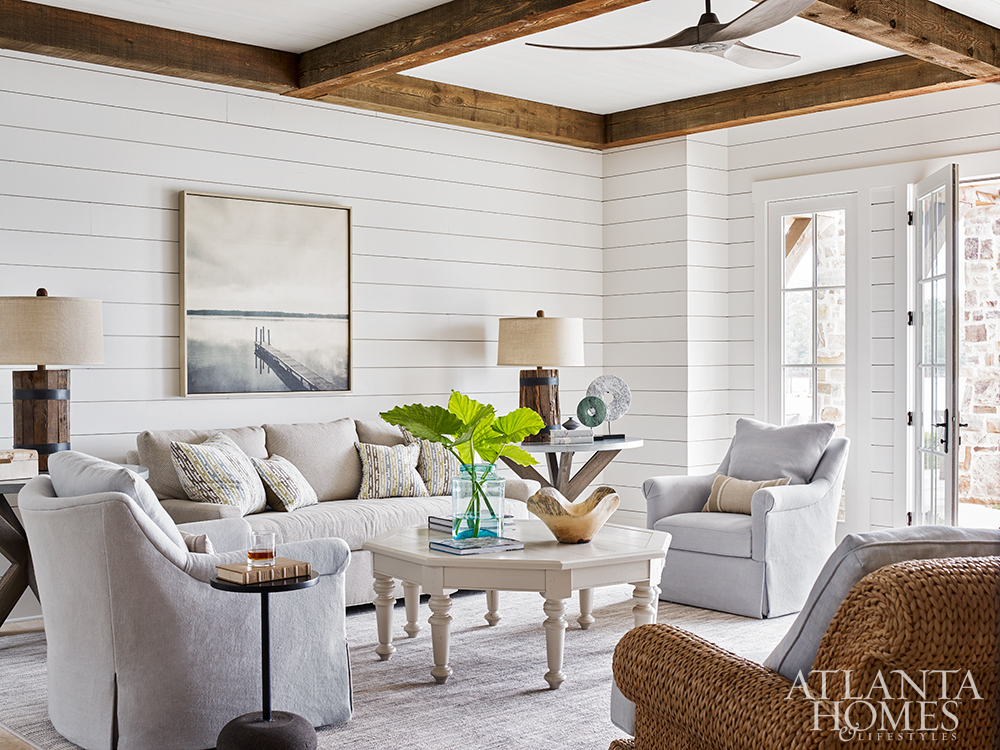 Lake Martin lake house designed by Liz Williams living room with beams and shiplap