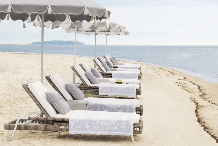 beach chaise lounge chairs and umbrellas