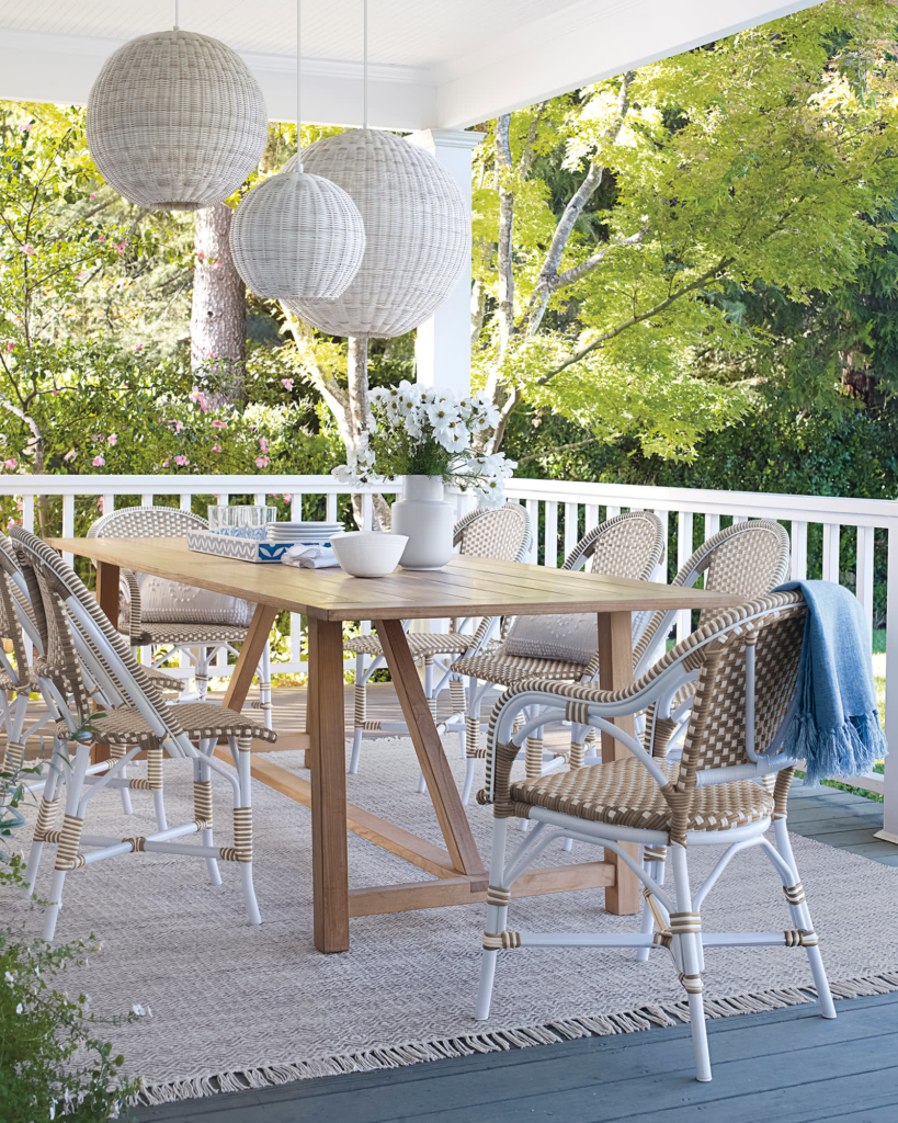 Serena & Lily porch dining with wicker pendants