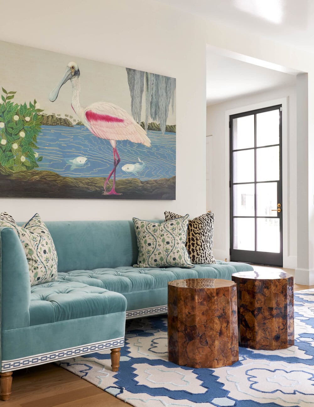 Mary Beth Wagner art in living room with turquoise velvet sofa
