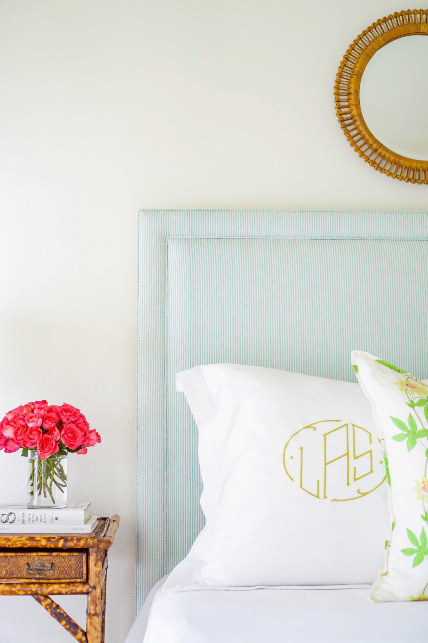 blue bedroom headboard with round mirror above -Emery Davis Photography Lindley Arthur Interiors