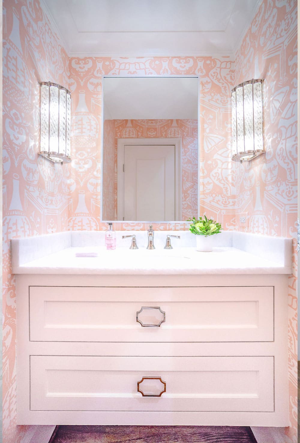 bathroom with pink and white wallpaper
