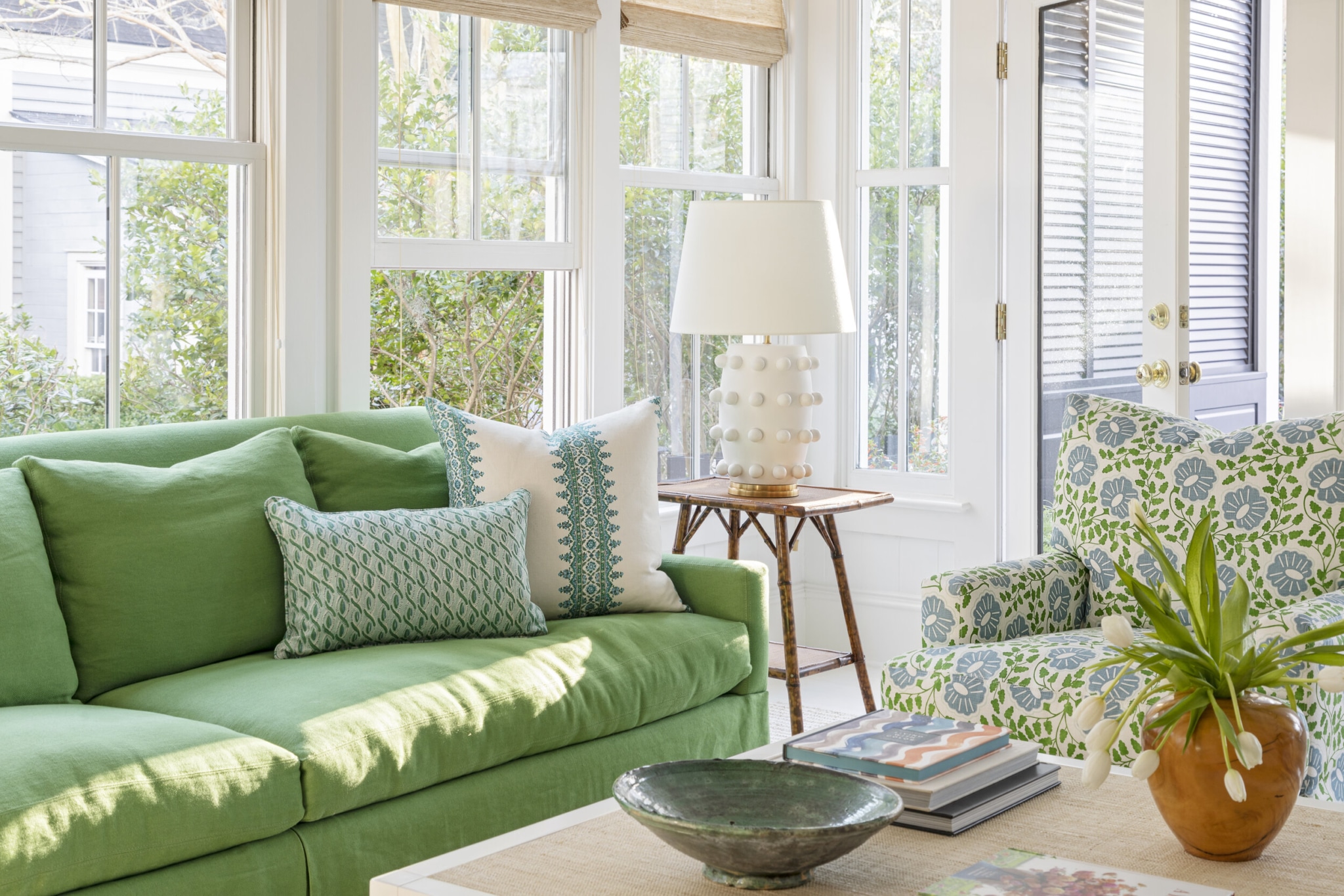 Allison Elebash Design | Julia Lynn Photography Mount Pleasant home -sunroom with hanging chandelier - love the seagrass coffee table and fiddle leaf fig tree - window seat - 