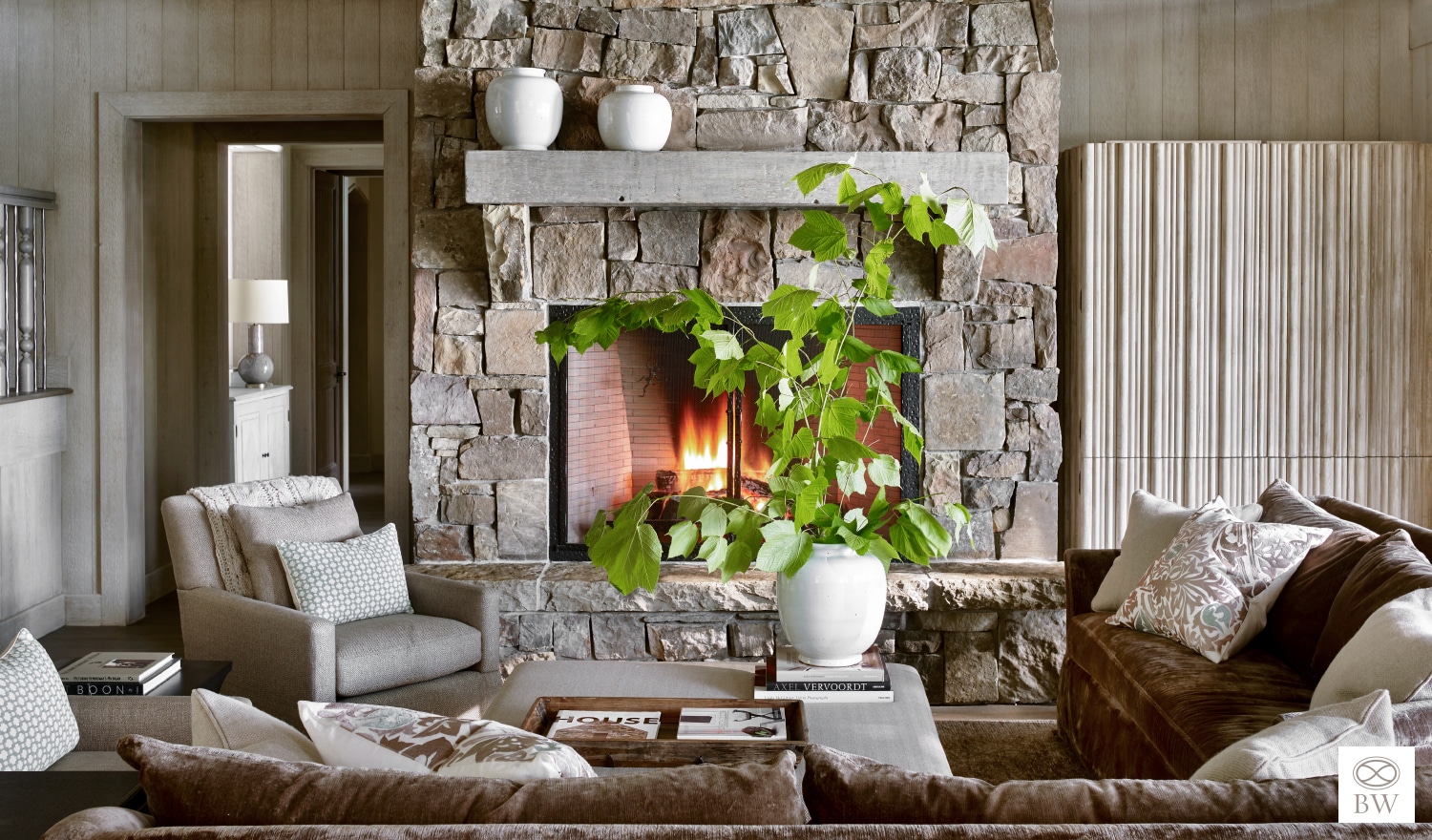 Tranquil Walloon Lake | Exterior Architect: Greg Pressley | Interior Architect: Peter Block | Interior Design: Beth Webb | Photography Emily Followill living room with stone fireplace. living room ideas | living room design | paneling | blonde wood