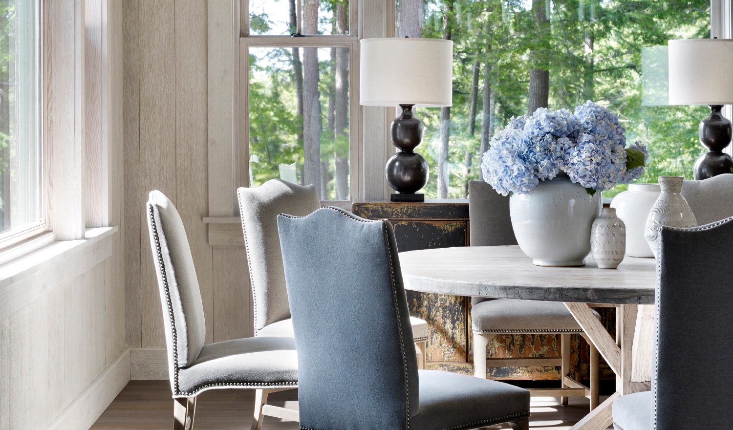Tranquil Walloon Lake | Exterior Architect: Greg Pressley | Interior Architect: Peter Block | Interior Design: Beth Webb | Photography Emily Followill dining room with round table. | dining room ideas | dining room design | dining room decor 