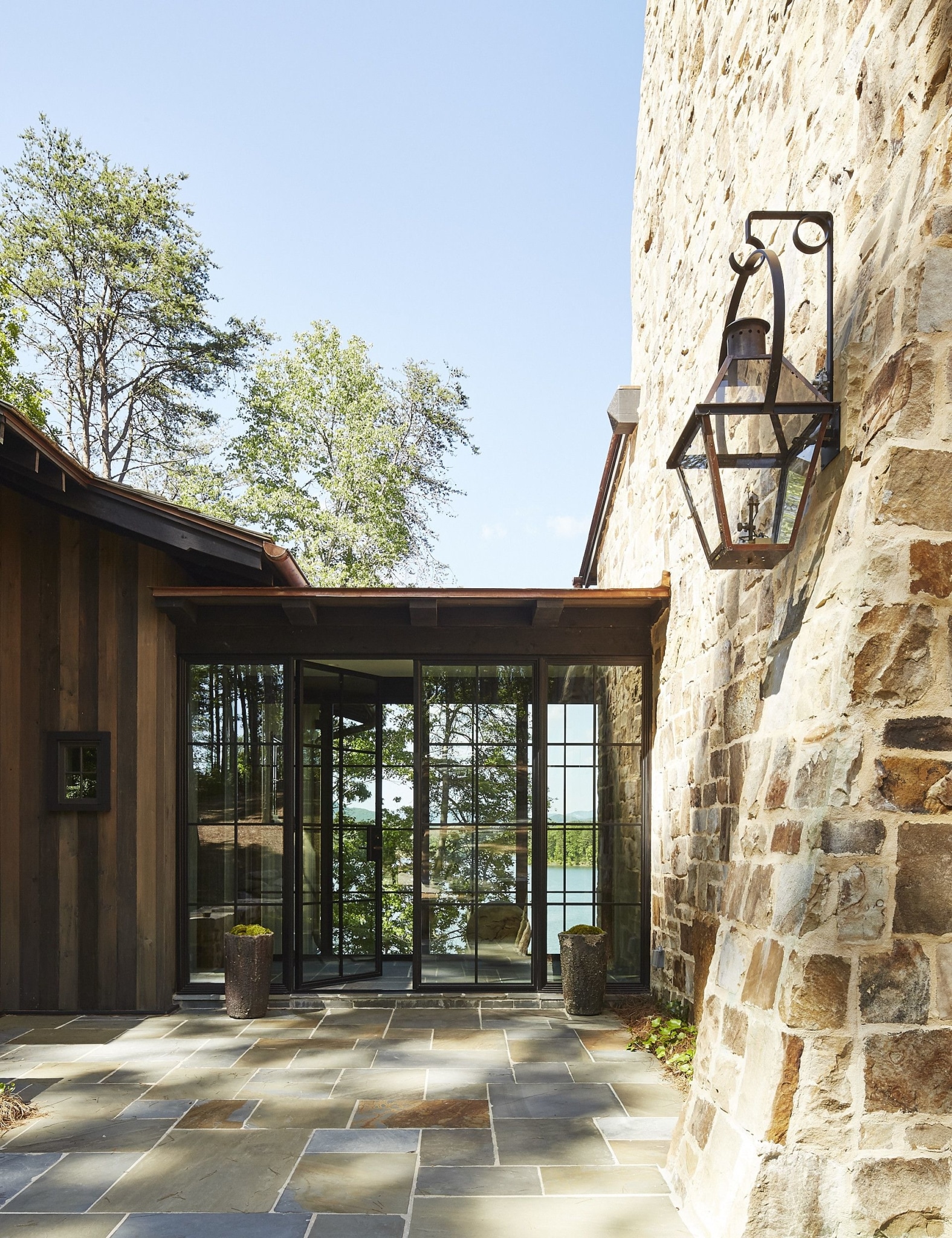 Jeffrey Dungan Architect | William Abranowicz Photography. | stone house | exterior | curb appeal | lantern | hanging lantern