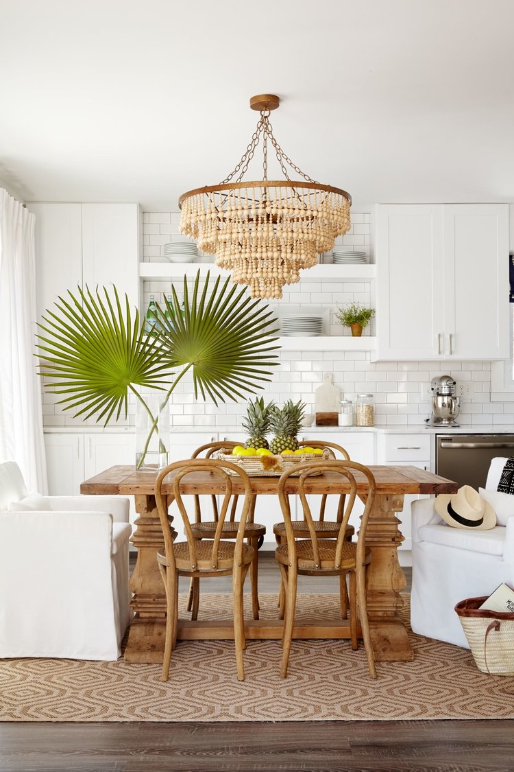 Stephanie Kraus Design - Photography @kylesmithborn - dine-in kitchen design - eat-in kitchen - palm leaves - antique dining table 