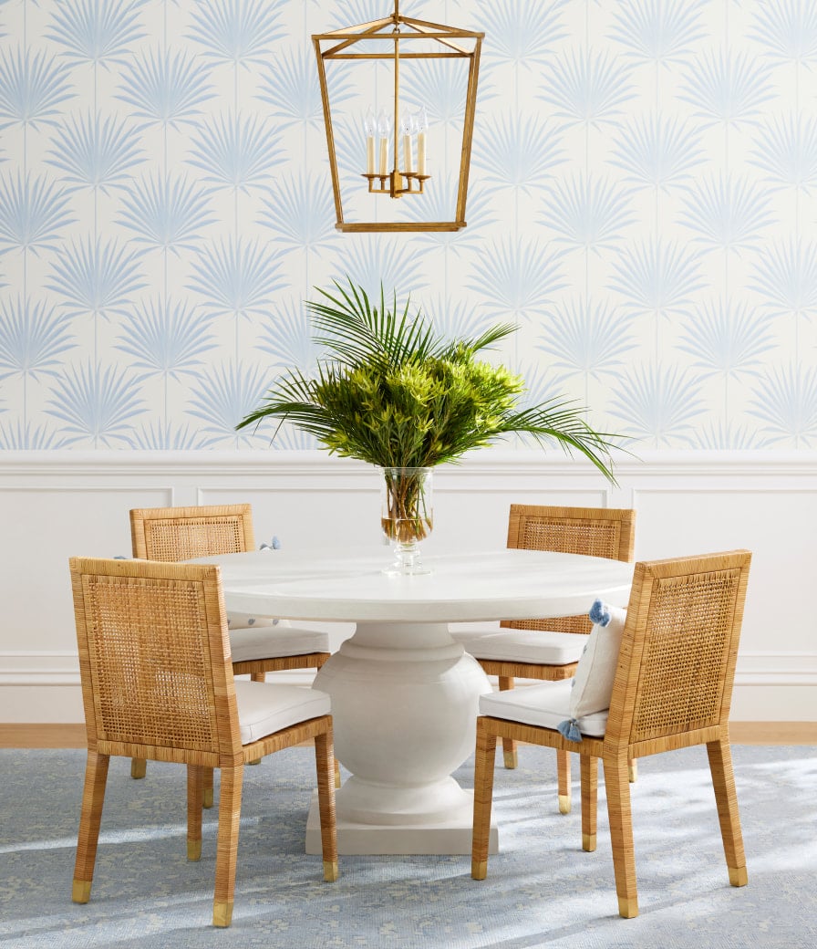 Serena & Lily gracious dining room with blue and white wallpaper and hanging brass lantern. Love the round table and balboa chairs with the thick weave for texture. dining room ideas | dining room decor |dining room design