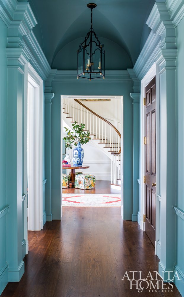 Source: Atlanta Homes & Lifestyles | Architect: C. Brandon Ingram | Interior Design: Mallory Mathison | Photography:  Jeff Herr - extraordinary hallway with deep moldings and hanging lanterns