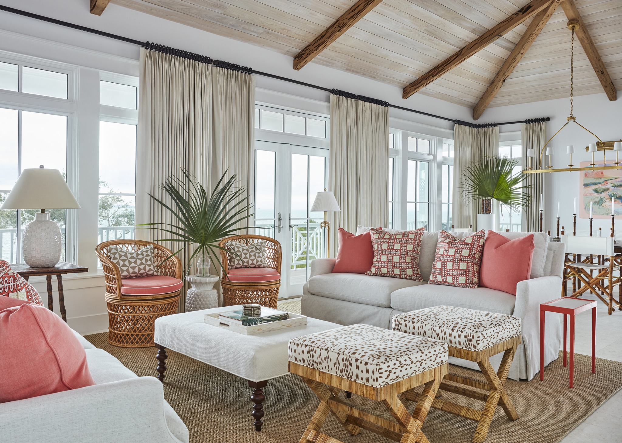 Kara Miller Interiors | Brantley Photography living room in coral and white. Love all of the textures and the wood beams. | living room design | living room ideas | living room decor | palm leaves | awash in color