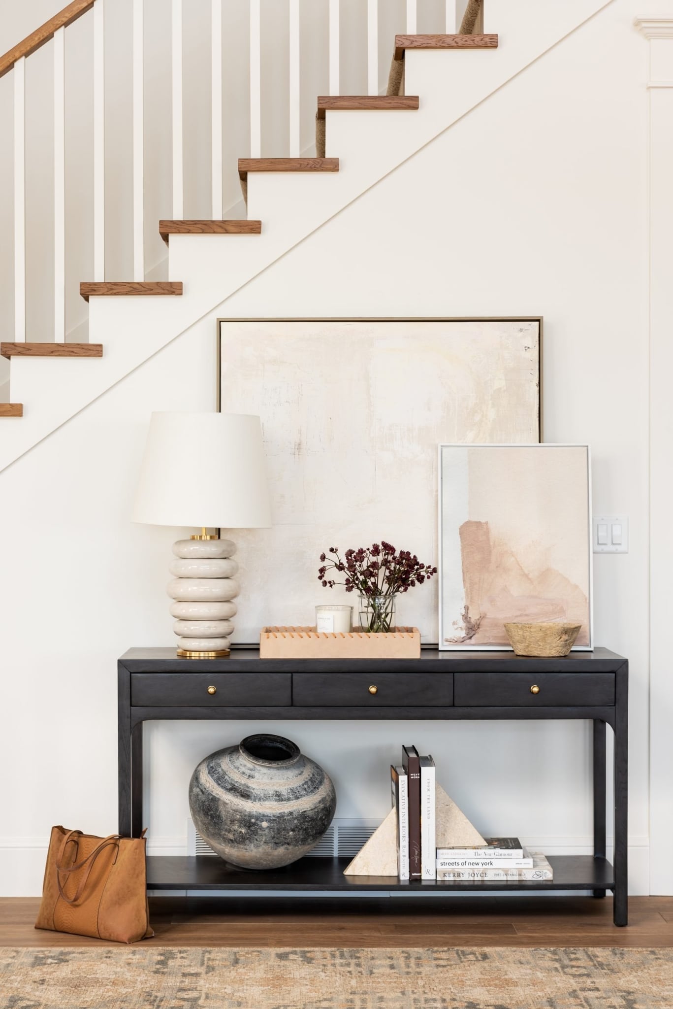 Creating a welcoming foyer with Studio McGee. Love the abstract art, lamp and beautiful decorative accessories. interiors | interior design | home decor | home design | foyer design | foyer decor | foyers | decor |