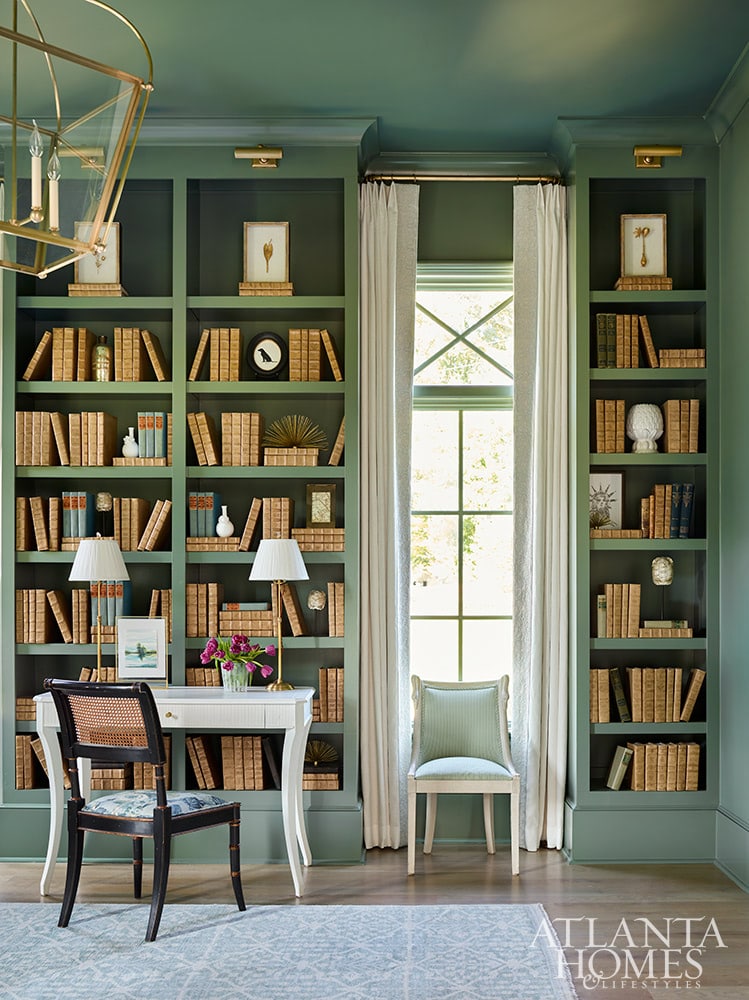 Southern charm house tour designed by T.S. Adams Studio, with interiors by Lauren DeLoach and photographed by the amazing Emily Followill - living room design - living room details - living room - living room remodel - bookcase - library lights - brass lantern