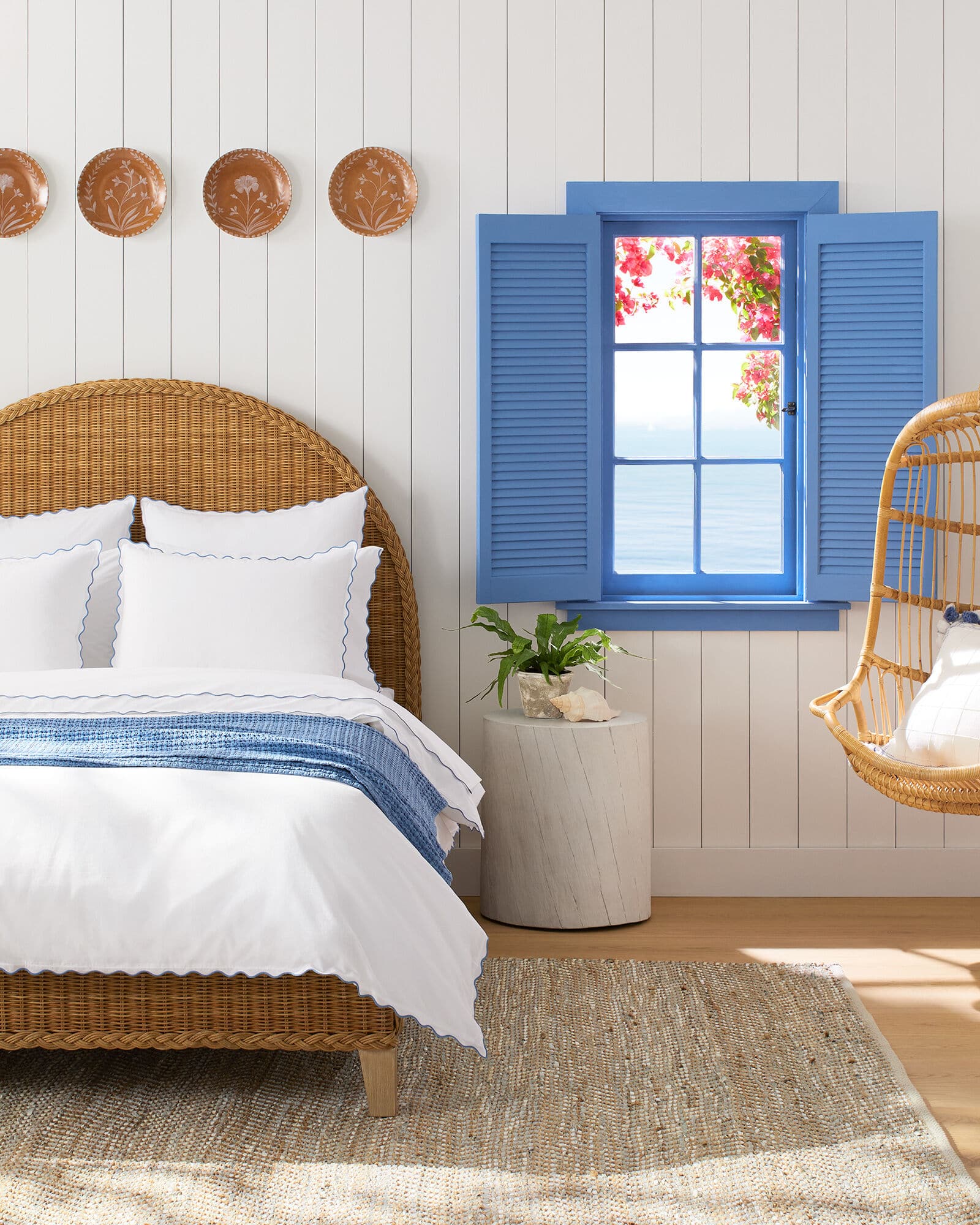 bedroom with wicker bed and natural area rug on sale - shiplap - hanging chair - Serena & Lily