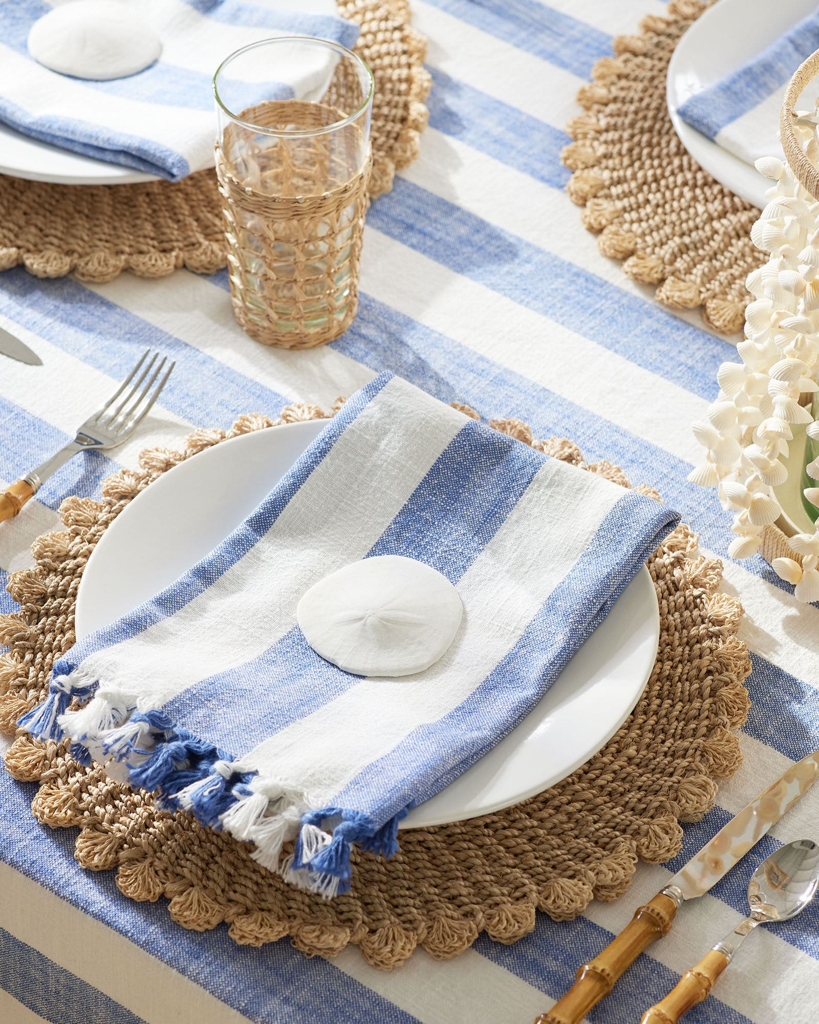 Tablesetting - blue and white stripe napkins - raffia placemats - Serena & lily