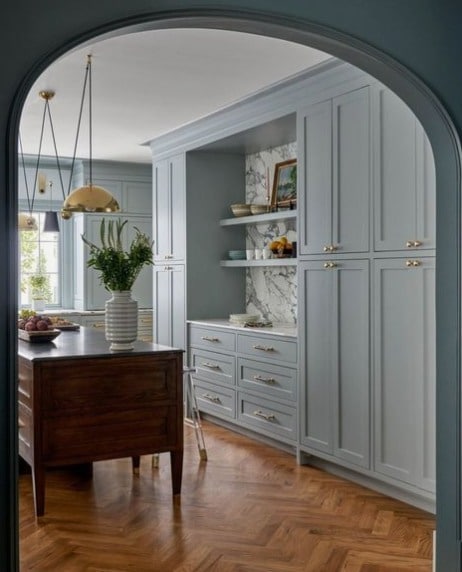 An arched opening + herringbone floors + blue cabinets = total perfection @dunbarroad!⁠
⁠
Photography:  @nathanschroderphoto⁠
⁠
#kitchen #kitchendesign #archway #herringbonepattern #herringbonefloors #housebeautiful #designchic