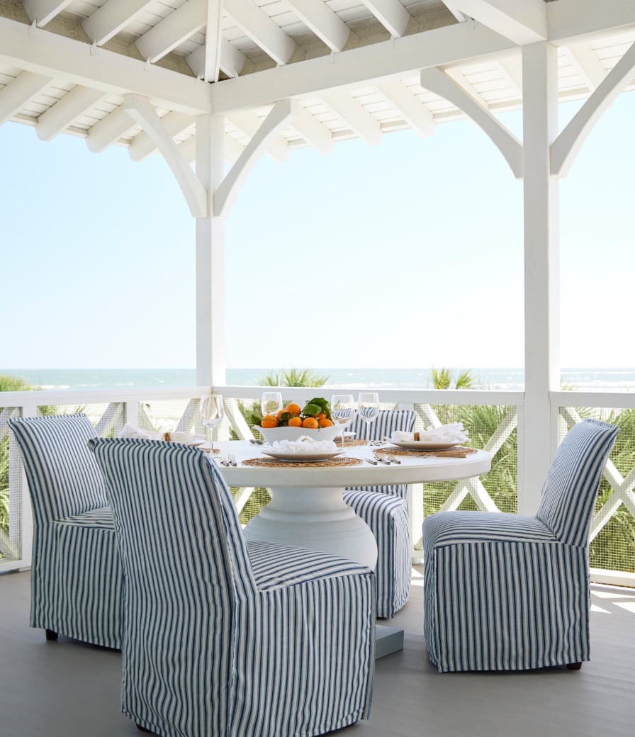 Serena & Lily outdoor dining - dining al fresco - dining alfresco = covered porch - oceanfront - beachfront - blue and white - blue and white stripe -fresh and inviting