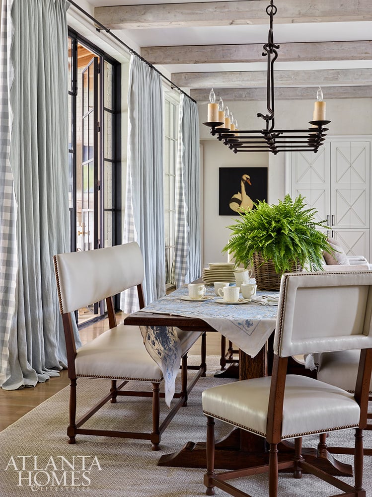 House Tour: Traditional Atlanta Home with a Modern Update Source: Atlanta Homes & Lifestyles Magazine | Architect T.S. Adams Studio | Designer: Lauren Deloach | Photography: Emily Followill | Builder: McCallum Custom Homes | dining room, rectangular table, wood beams