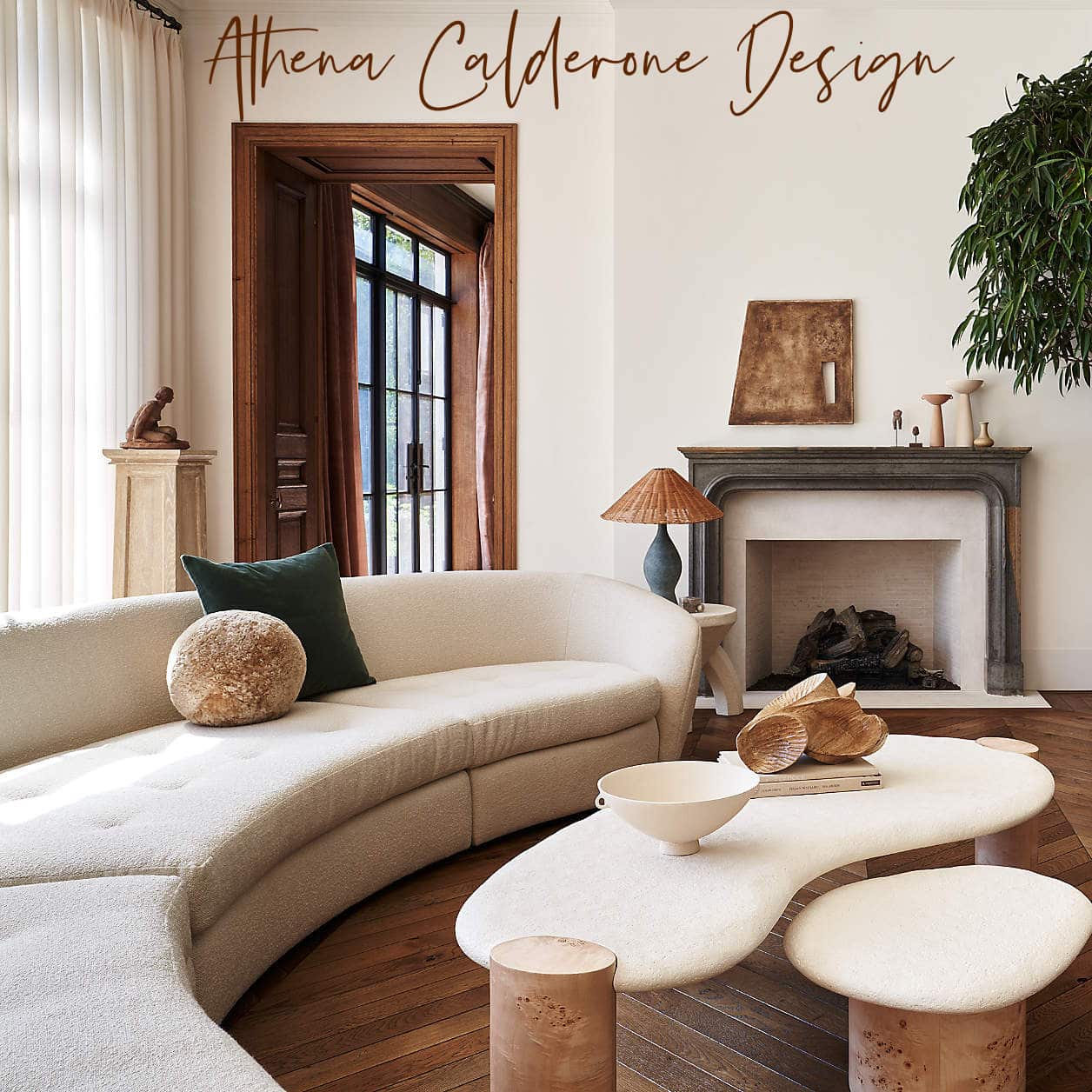 Athena Calderone 's new collaboration with Crate and Barrel - living room with curvy sofa, beautiful coffee table and amazing decor, 