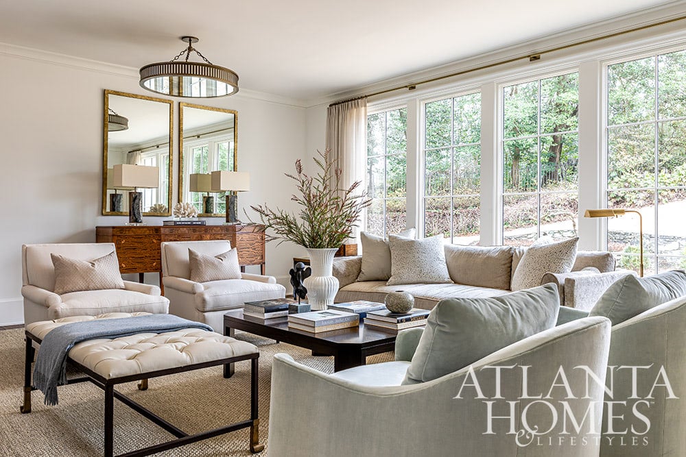 Anna Booth, a talented interior designer, undertook the remarkable task of transforming a 1940s Buckhead home into a captivating contemporary French-inspired residence. living room, living room design, living room decor, neutral decor