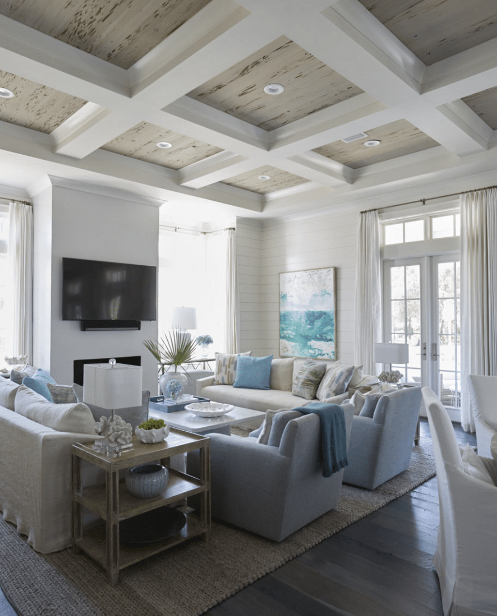 Nestled in the serene beauty of Santa Rosa Beach, this dreamy beach house designed by Geoff Chick Architects captivates the heart with its elegant and calming design, showcasing a harmonious blend of blue and white tones that mirror the nearby ocean waves and sandy shores. - Colleen Duffley Productions