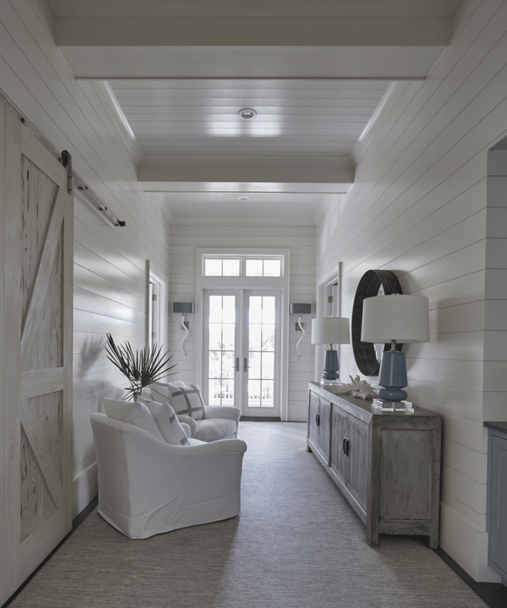  Geoff Chick Architects captivates the heart with its elegant and calming design, showcasing a harmonious blend of blue and white tones that mirror the nearby ocean waves and sandy shores. - Colleen Duffley Productions