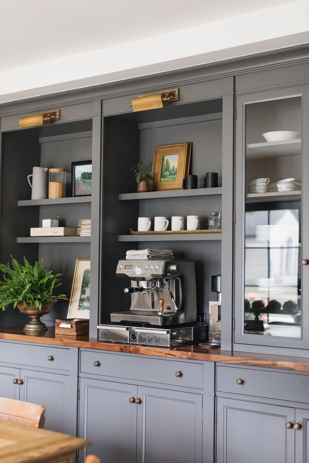 Designing a small coffee bar within your kitchen can add both functionality and charm to your space. Jean Stoffer Design | Stoffer Photography Interiors