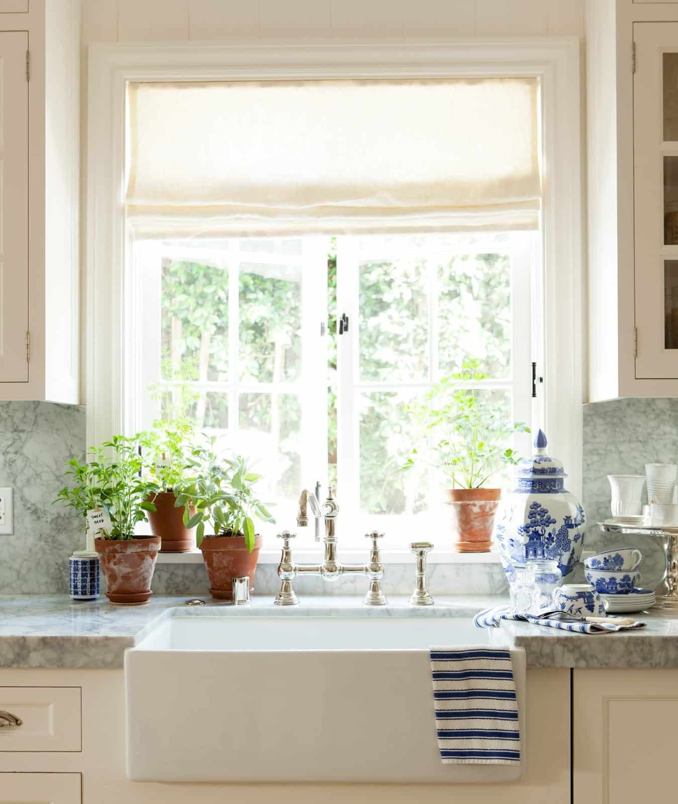 A blue and white kitchen presents a timeless and elegant color palette that's both calming and stylish and Mark D. Sikes demonstrates just that. - Amy Neunsinger Photography