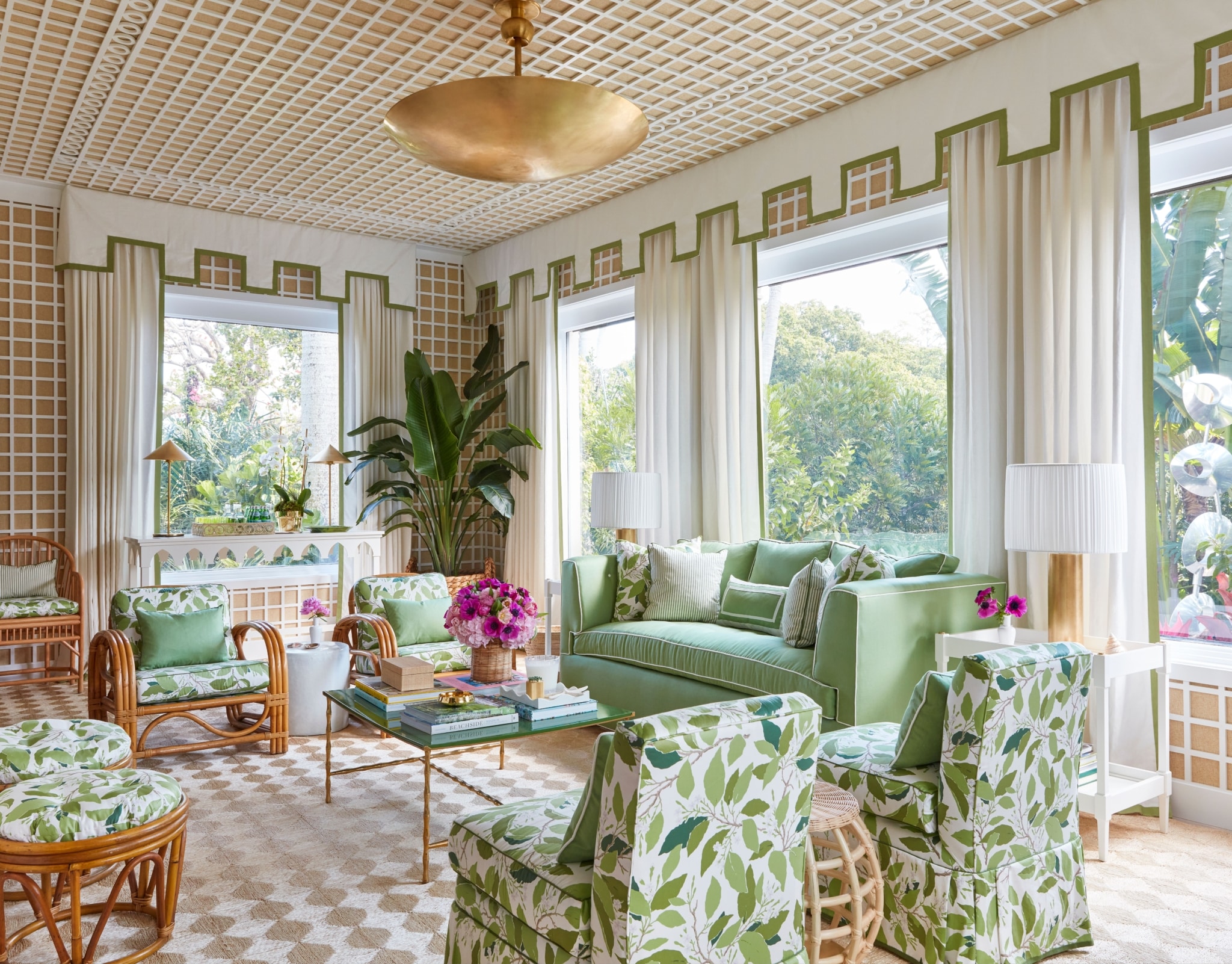 Palm Beach living room with gold chandelier and lattice walls and ceiling