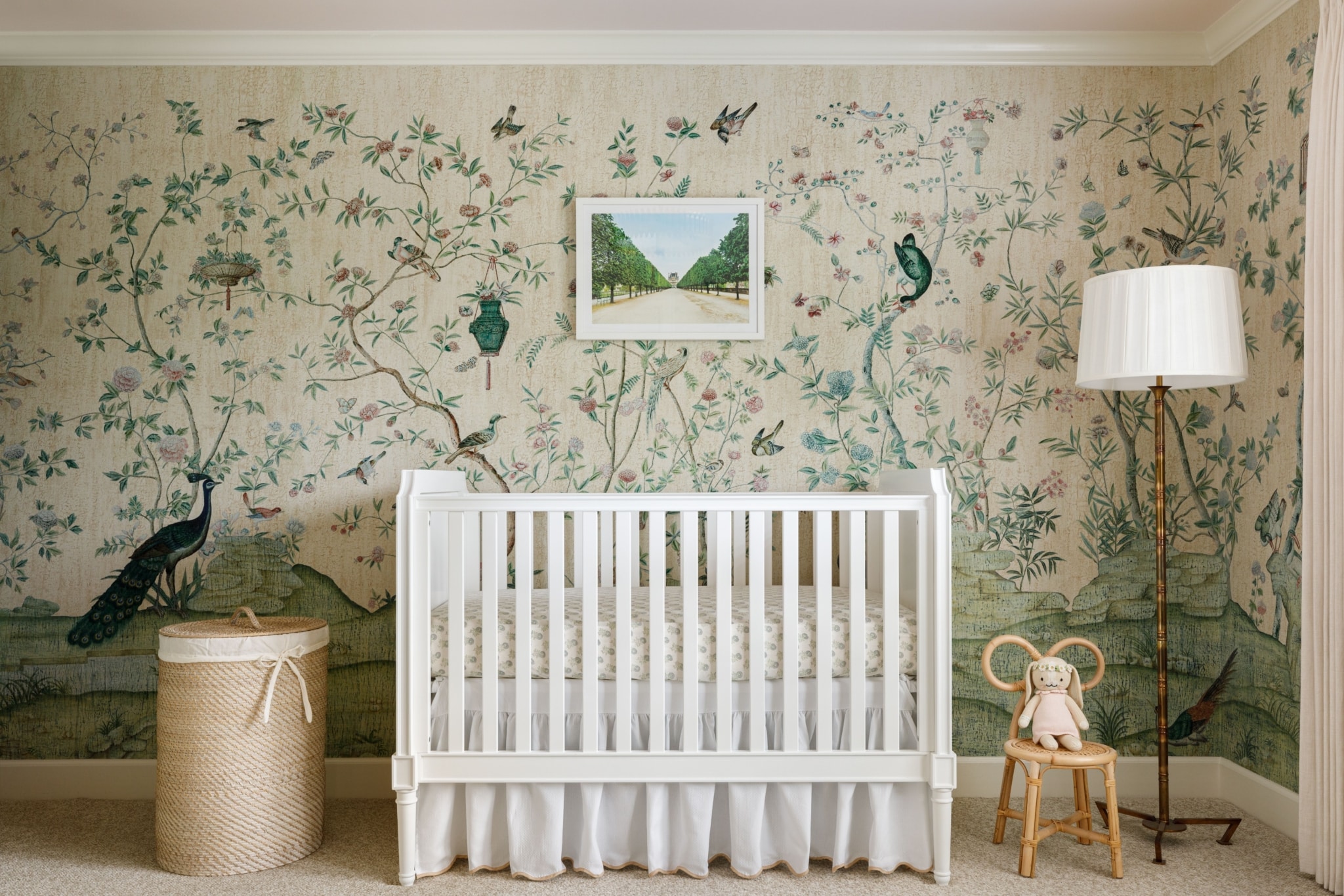 Paloma Contreras, celebrated interior designer and tastemaker, has once again captivated design enthusiasts with her latest book, The New Classic Home: Where Timeless Style Meets Modern Design. Aimée Mazzenga Photography - white crib with white bedding, deGournay wallpaper