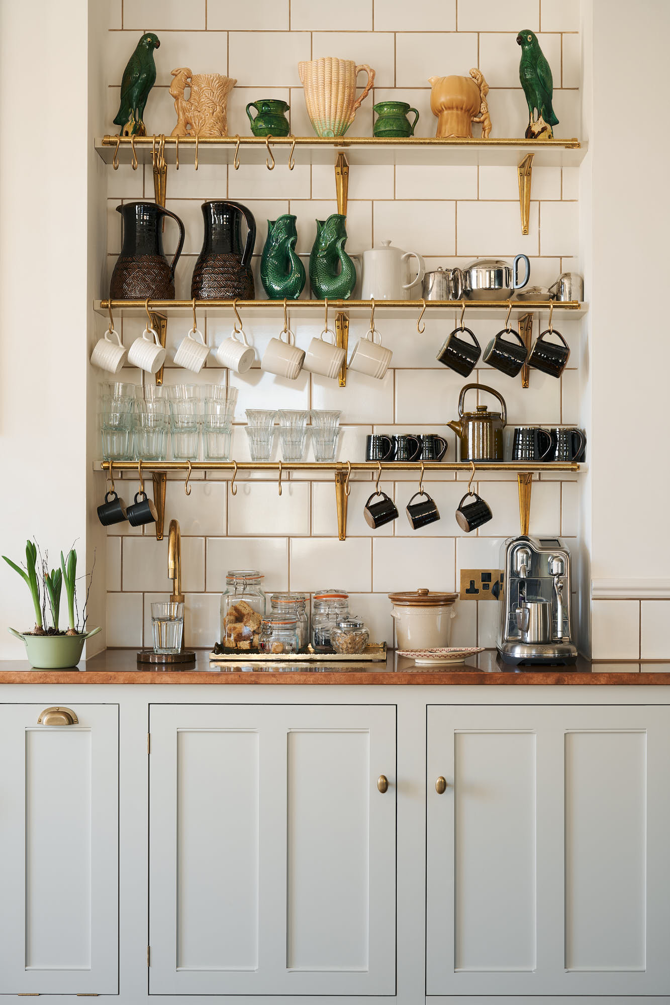fabulous kitchen from deVOL. This one has us teeming with inspiration! Love this coffee bar with brass wall hanging with hooks