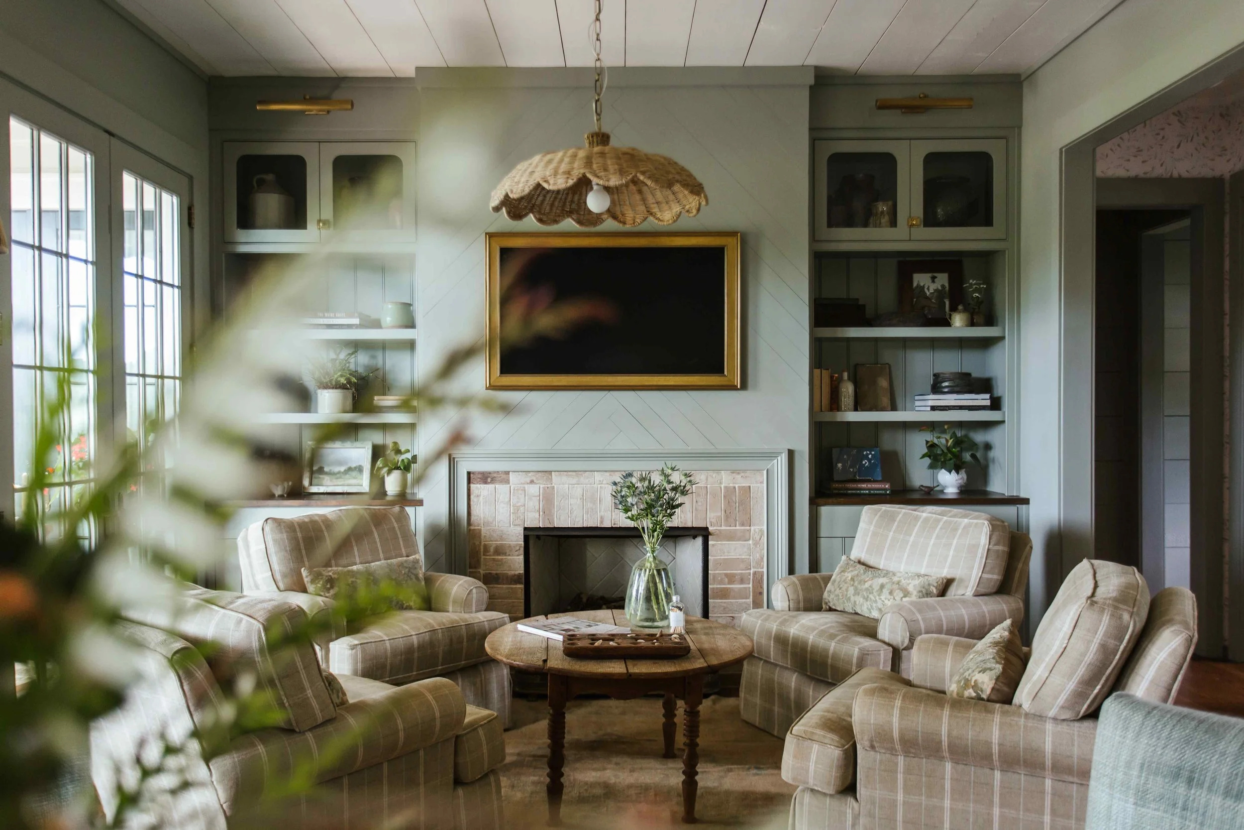 Perfectly proportioned, wholly welcoming and full of Southern charm, this beautiful farmhouse designed by The Misfit House and photographed by the amazing Kristin Karch Photography  is totally making our day.  Take a peek, and we think you’ll understand why! Love the four chair seating area in the living room with the shiplap ceiling