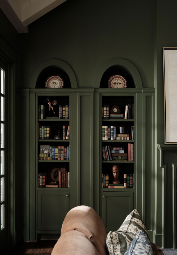 Great design is all about the details. And no one’s work embodies that more than the good taste of Sabbe Interior Design.  With her brilliant use of layering in interior design, she designs chic and sophisticated spaces that are perfect for family living!  Warm, inviting and completely livable…what could be better. Beautiful dark green arched bookcases - Joseph Bradshaw Photography