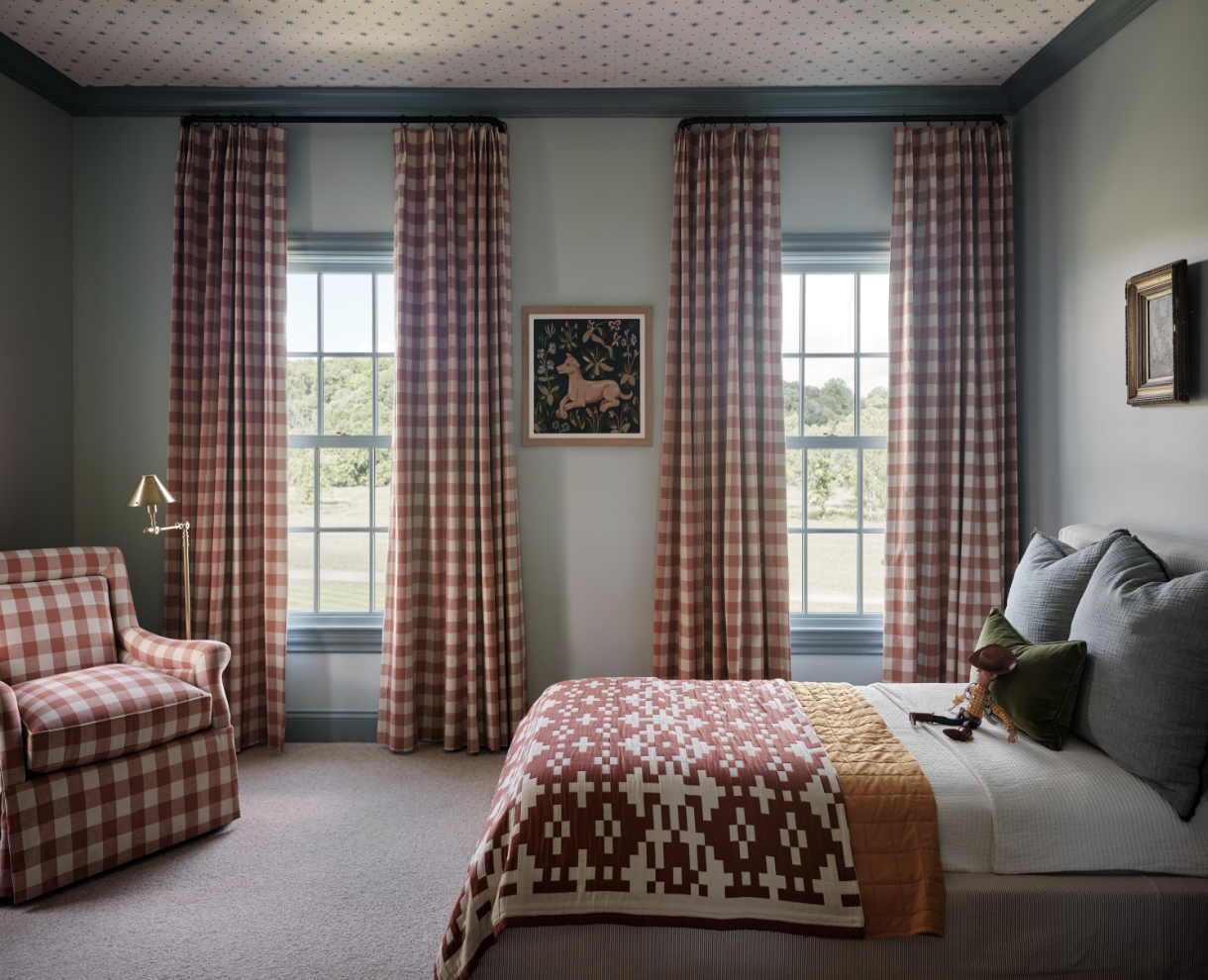Great design is all about the details. And no one’s work embodies that more than the good taste of Stephanie Sabbe.    Warm, inviting and completely livable…what could be better. Joseph Bradshaw Photography - brick red and blue bedroom