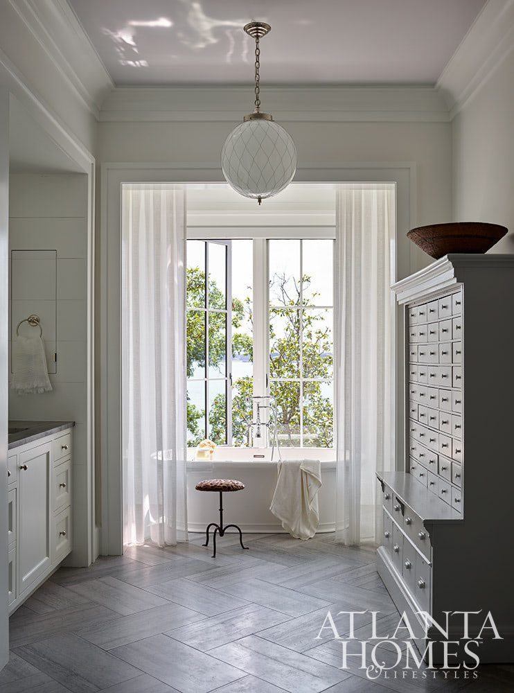 As summer comes to an end, we hope you can steal away for a moment to take a peek at this gorgeous Lake Norman home so beautifully photographed by Emily Followill and chicly styled by Eleanor Roper.  It’s a peaceful, calming home–with incredible views–that just might lend you a moment of serenity as you savor these stunning interiors.  Jacquelynne P. Lanham Designs created a space that truly feels like a zen retreat, the perfect place to start a stress-free fall! Beautiful bathroom with views of the lake Source: Atlanta Homes & Lifestyles Interior Designer: Jackye Lanham, Jacquelynne P. Lanham Designs  Architect: John D. Haley, John D. Haley  Builder: Scott McMillan, Kingswood Custom Homes, Inc. Landscape Architect: John Howard, Howard Design Studio