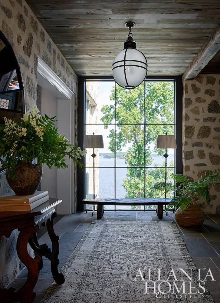 As summer comes to an end, we hope you can steal away for a moment to take a peek at this gorgeous Lake Norman home so beautifully photographed by Emily Followill and chicly styled by Eleanor Roper.  It’s a peaceful, calming home–with incredible views–that just might lend you a moment of serenity as you savor these stunning interiors.  Jacquelynne P. Lanham Designs created a space that truly feels like a zen retreat, the perfect place to start a stress-free fall! Entrance foyer in a Lake Norman home with gorgeous views Source: Atlanta Homes & Lifestyles Interior Designer: Jackye Lanham, Jacquelynne P. Lanham Designs  Architect: John D. Haley, John D. Haley  Builder: Scott McMillan, Kingswood Custom Homes, Inc. Landscape Architect: John Howard, Howard Design Studio