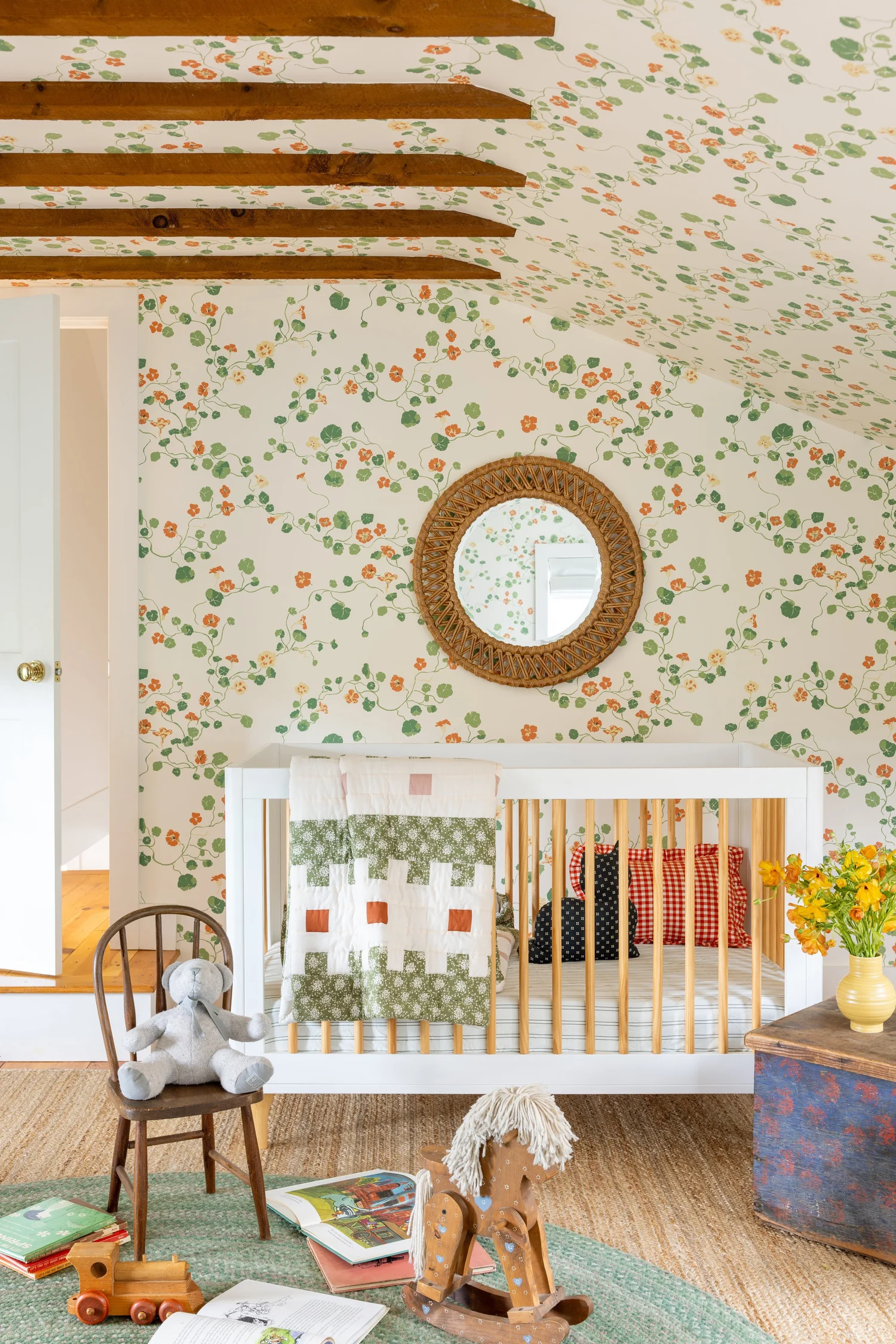 Discover 6 cozy home decor tips to make your home inviting. From simple decor updates to warm lighting ideas, create a space you’ll love! Ariel Okin Interior Design | Julie Leffell Photography - adore the nursery with wood beams and charming wallpaper
