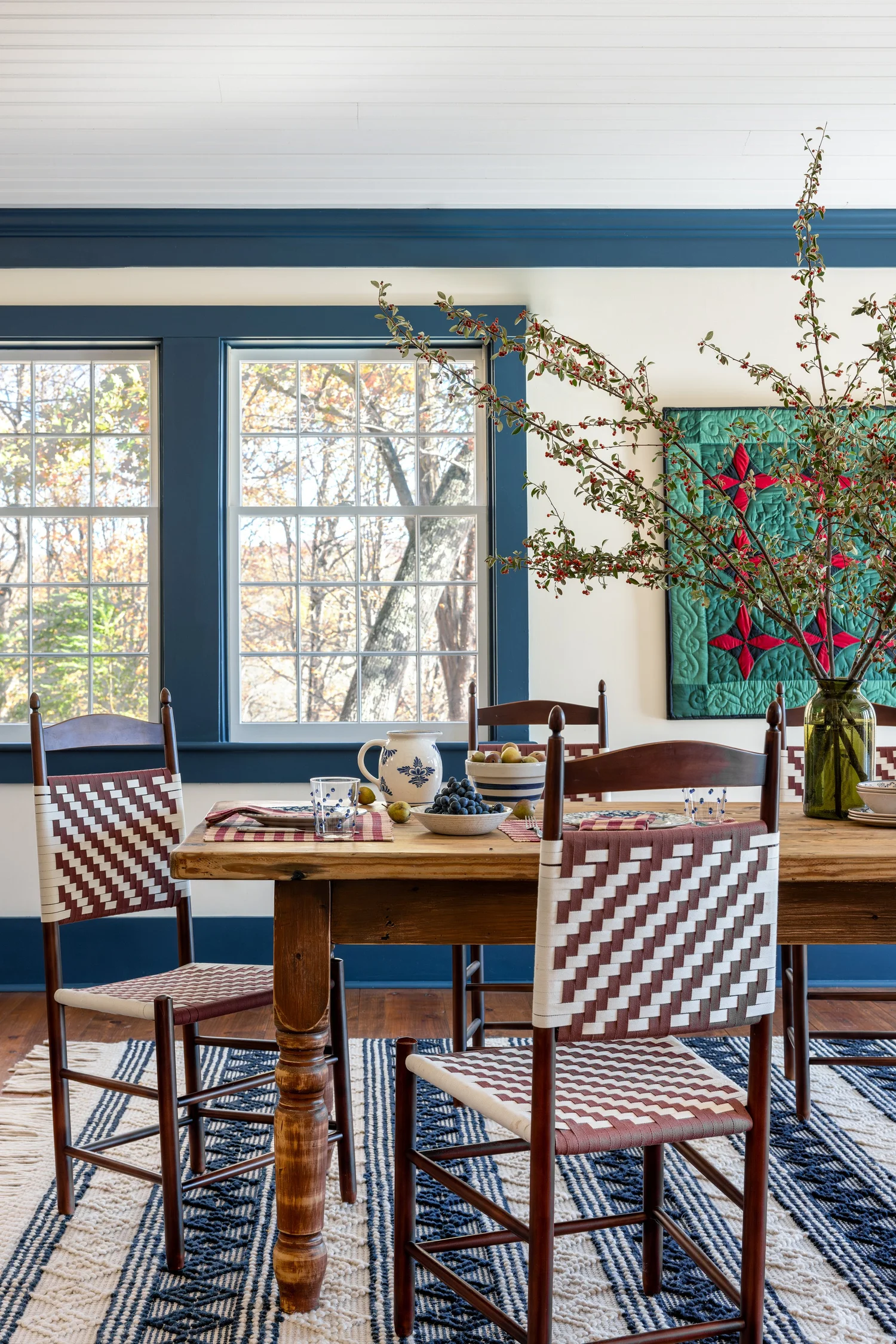 Discover 6 cozy home decor tips to make your home inviting. From simple decor updates to warm lighting ideas, create a space you’ll love! Ariel Okin Interior Design | Julie Leffell Photography - beautiful dining room with hanging quilt
