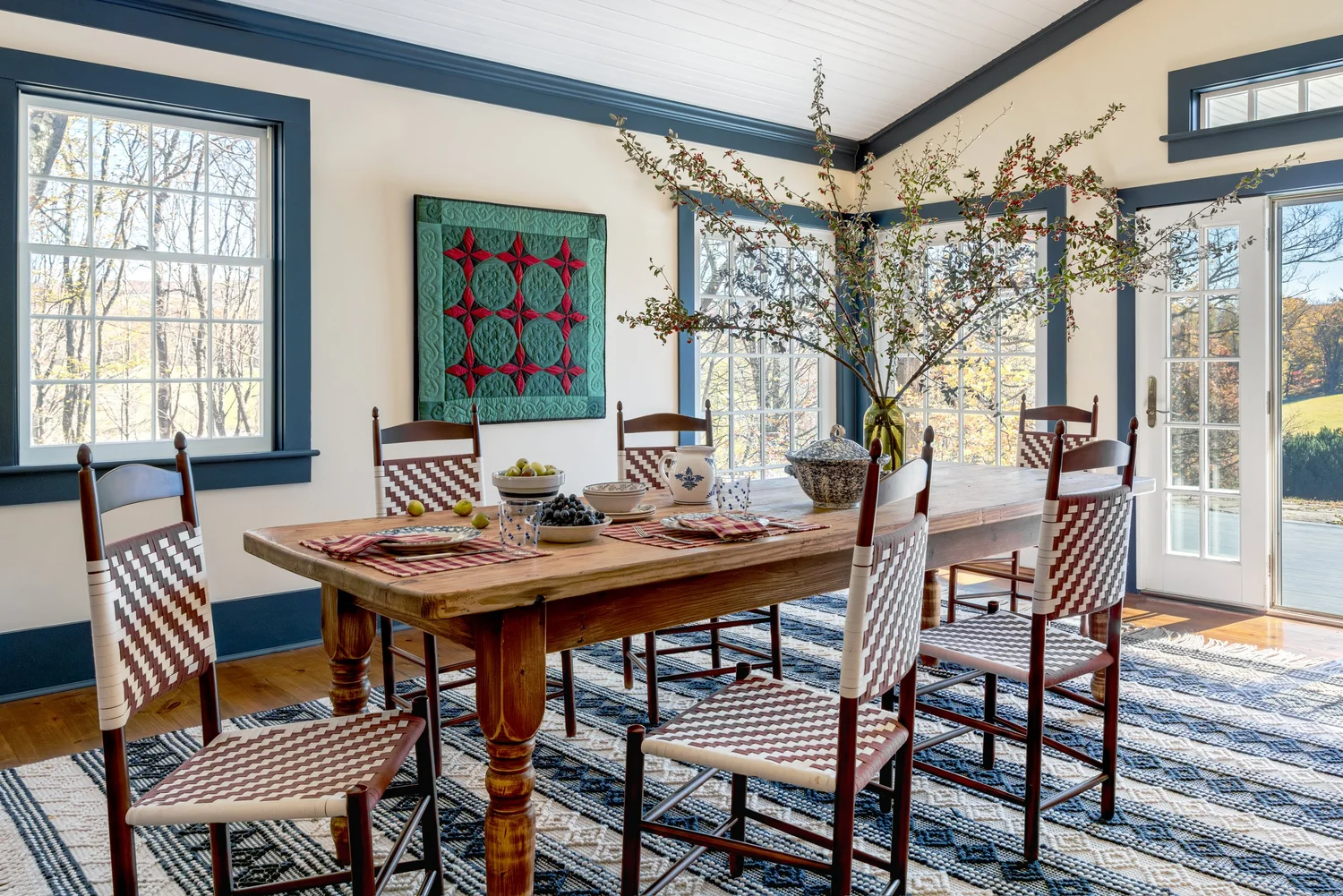 Discover 6 cozy home decor tips to make your home inviting. From simple decor updates to warm lighting ideas, create a space you’ll love! Ariel Okin Interior Design | Julie Leffell Photography - Beautiful dining rooms with hanging quilt