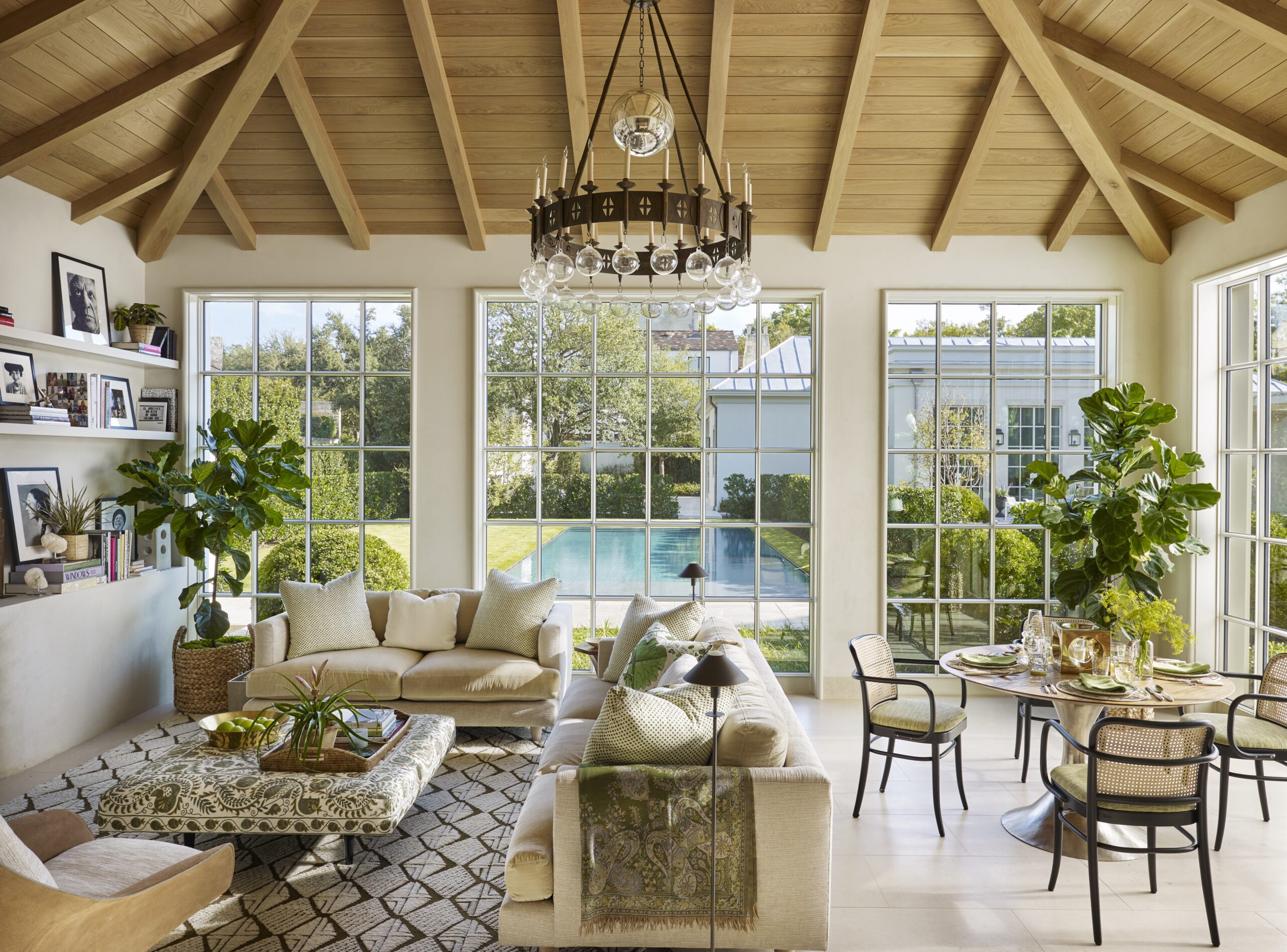Tom Scheerer's new coffee table book, STILL DECORATING, is absolutely brimming with breathtaking work that is sure to leave every reader inspired. It is filled with perfect examples of this standout designer's peerless style. beautiful living room with a cathedral ceiling and wood beams 