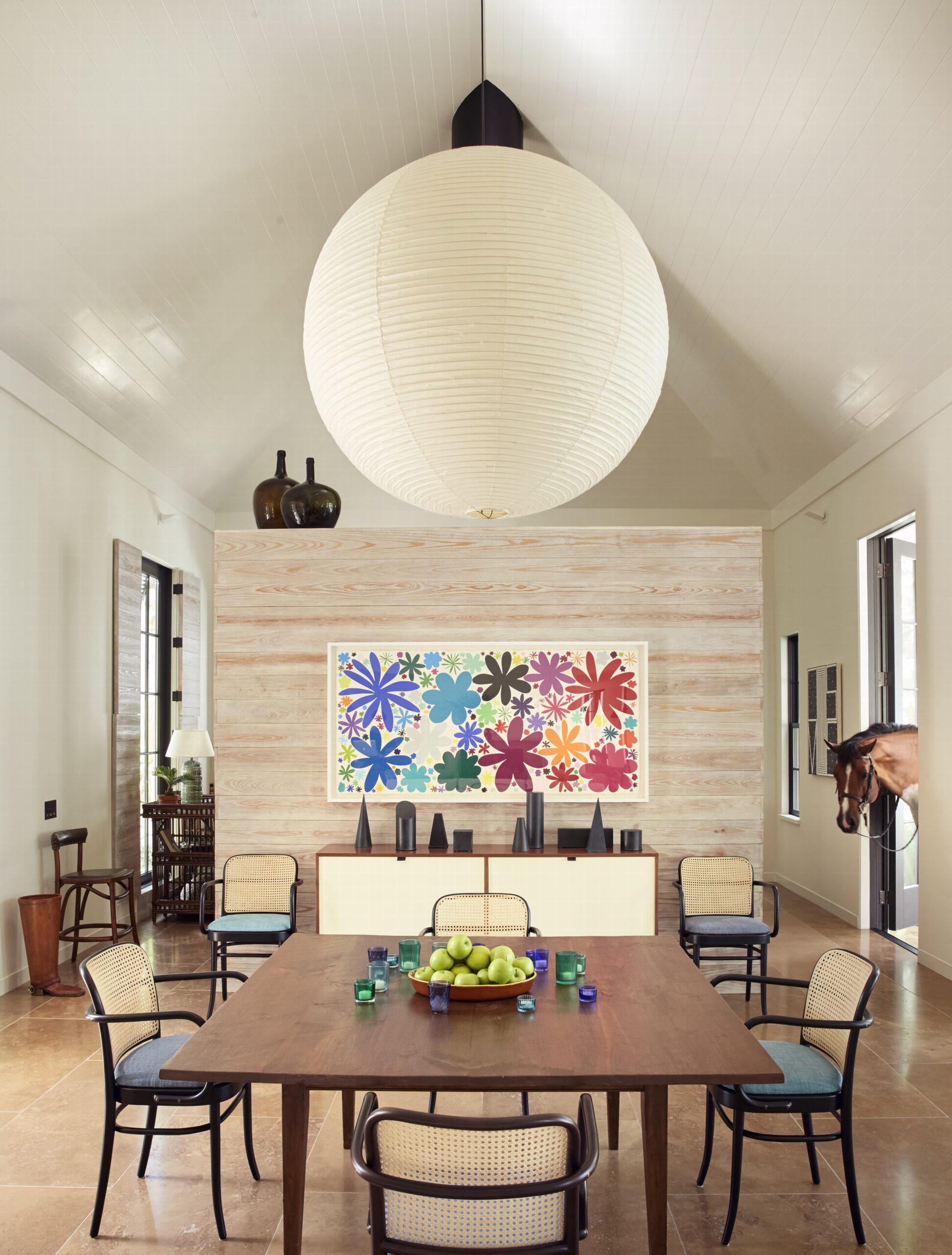 Tom Scheerer's new coffee table book, STILL DECORATING, is absolutely brimming with breathtaking work that is sure to leave every reader inspired. It is filled with perfect examples of this standout designer's peerless style. beautiful dining room with antique wicker chairs and large Noguchi oriental lighting Images courtesy of Vendome Press Photography Francesco Lagnese
