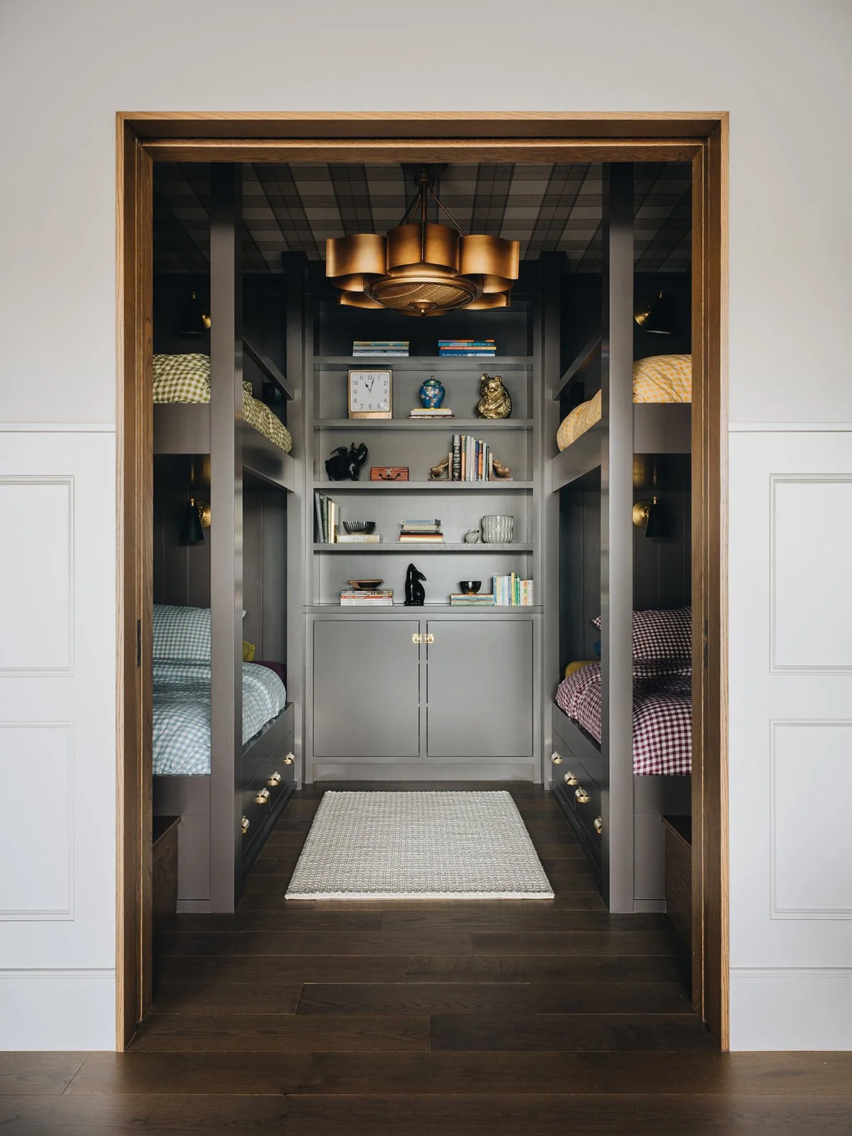 Relax, brew an extra cup of coffee and take a peek at this Jean Stoffer designed bunkroom, beautifully photographed by Stoffer Photography Interiors, that is so unforgettably chic you’ll undoubtedly find yourself daydreaming about a few little changes for you own home. 