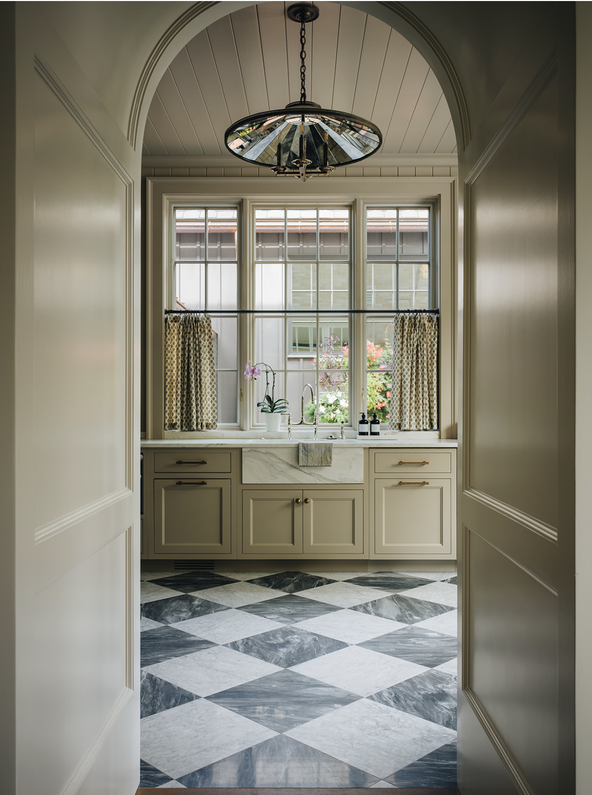 Interior Design: @jeanstofferdesign Build: @zahnbuildersinc Architecture: @jameslarew Photography: @stofferphotographyinteriors We hope you are having a great week–and are in the mood for touring a one-of-a-kind home designed by the talented Jean Stoffer Design and beautifully photographed by Stoffer Photography Interiors.  Neutral enough to be calm, textured enough to be interesting, and layered into complete coziness, this is the perfect home for friends and family. Love the archway into the kitchen with black and white marble floors and farmhouse sink